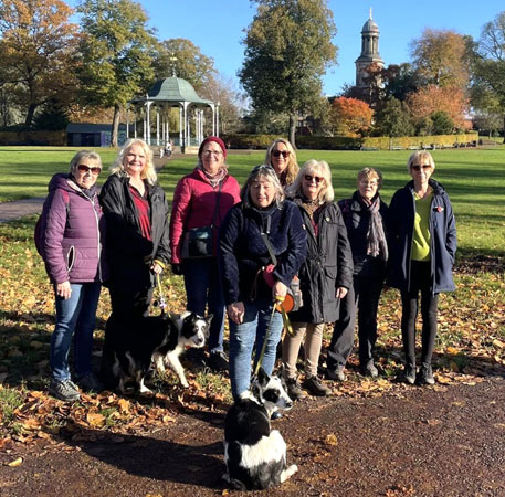 A group of ladies and dogs are ready for a walk in Shrewsbury's Quarry